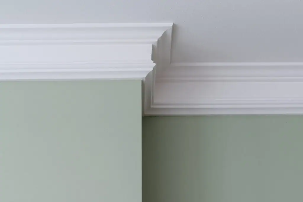 Crown molding and smooth wall surface in a modern interior setting.